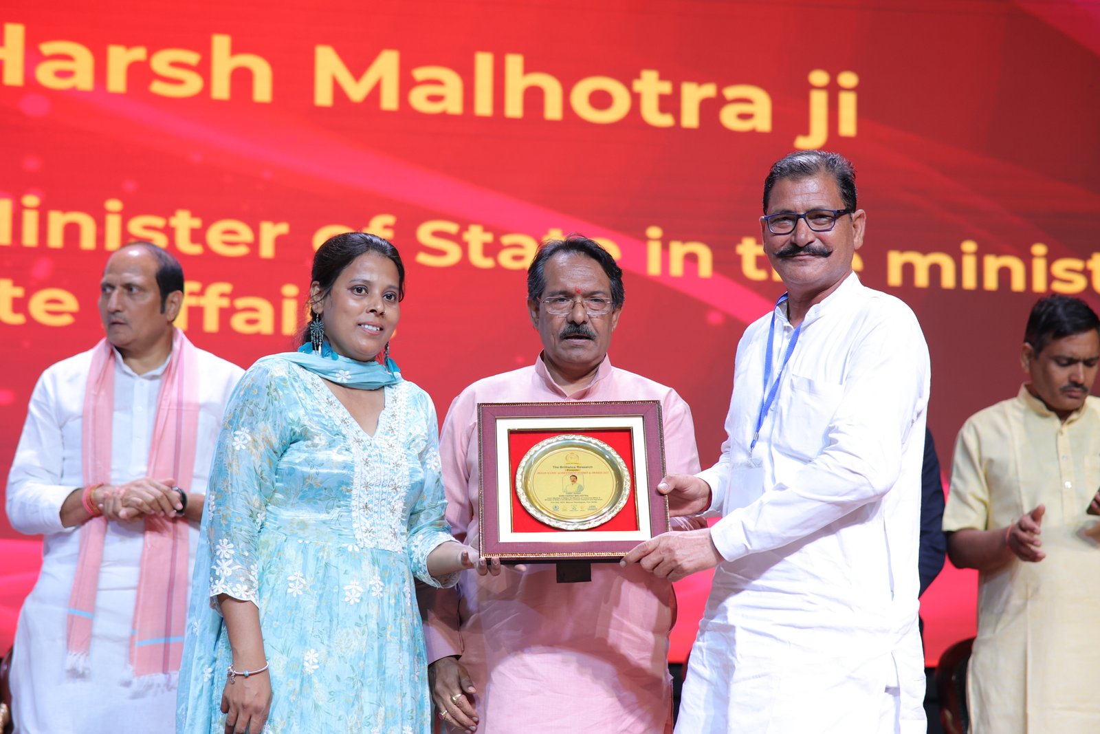 Award winner receiving trophy
